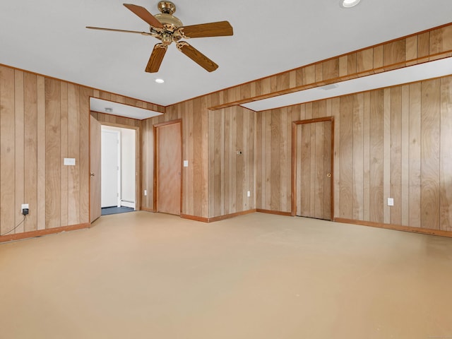 29 Washington Dr, Groton, CT 06340 - empty room with wood walls, baseboards, a ceiling fan, and a baseboard heating unit