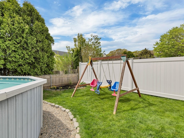 29 Washington Dr, Groton, CT 06340 - view of play area with a fenced backyard and a yard