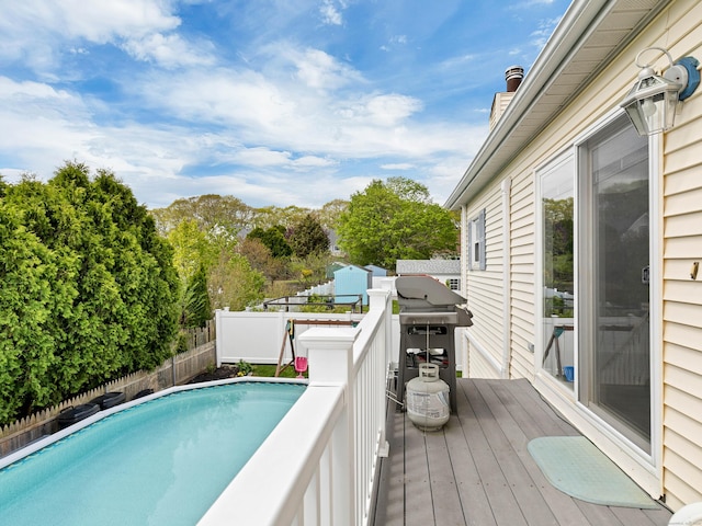 29 Washington Dr, Groton, CT 06340 - view of swimming pool with a fenced backyard, grilling area, a wooden deck, and a fenced in pool