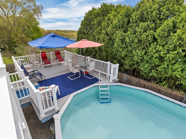 29 Washington Dr, Groton, CT 06340 - view of swimming pool featuring a deck, a fenced in pool, and fence