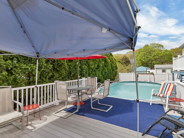 29 Washington Dr, Groton, CT 06340 - view of pool with outdoor dining area, fence, a fenced in pool, and a deck
