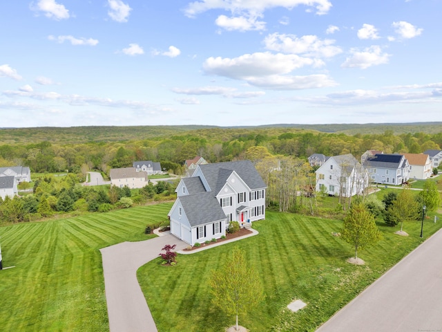 view from above of property featuring a heavily wooded area