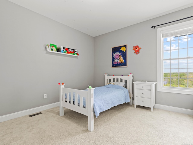 carpeted bedroom with baseboards