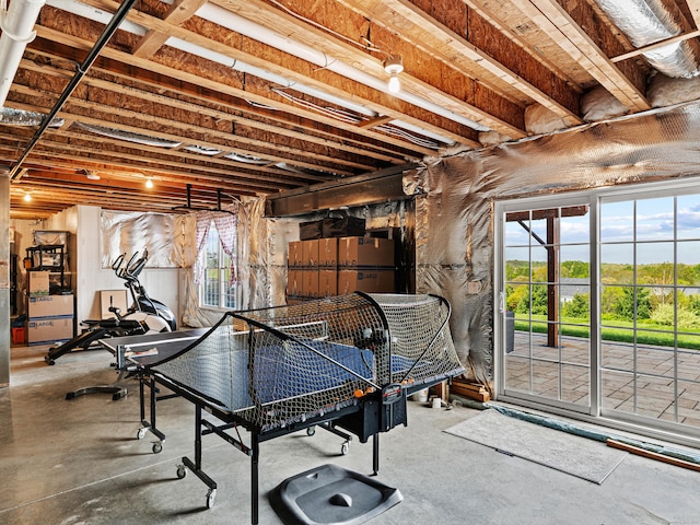 rec room with concrete floors