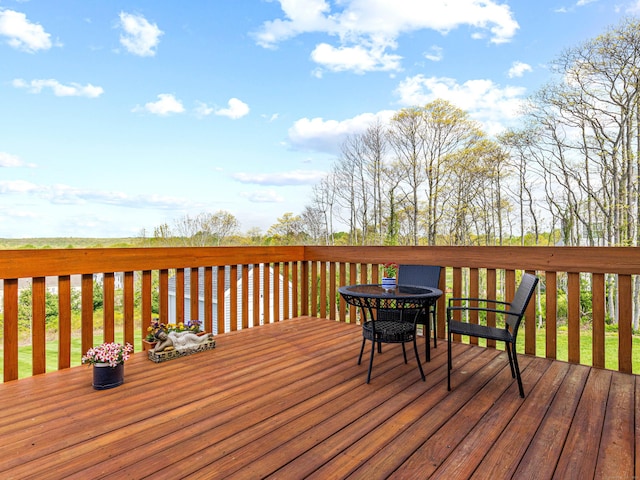 wooden deck with outdoor dining area