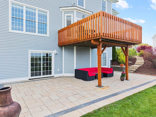 view of patio / terrace with an outdoor living space and a wooden deck