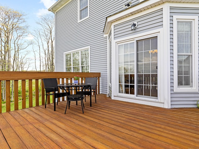 wooden deck with outdoor dining space
