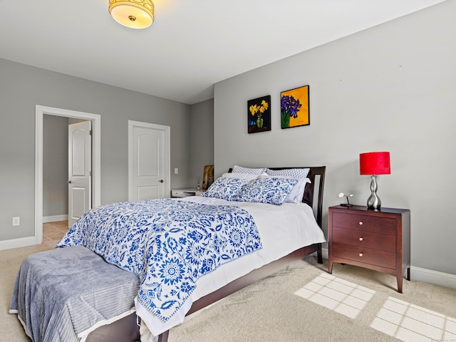 bedroom with baseboards and carpet flooring