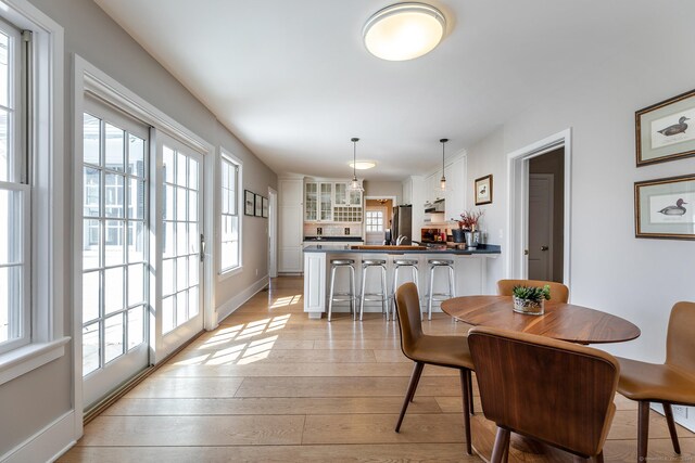108 E St, Washington, CT 06793 - dining area featuring light wood-style flooring and plenty of natural light