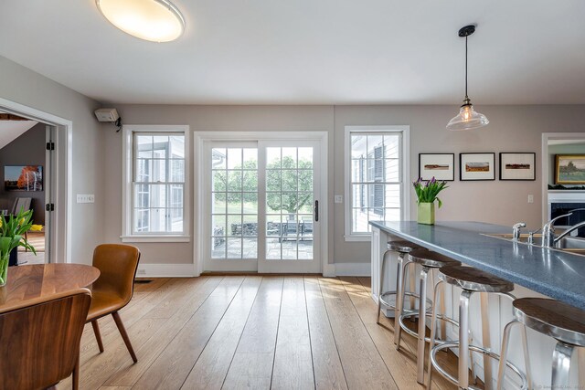 108 E St, Washington, CT 06793 - doorway featuring light wood-type flooring, baseboards, and a sink