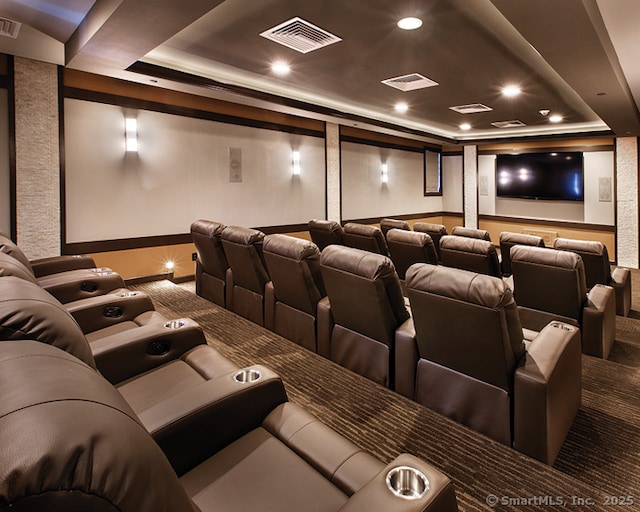 home theater featuring carpet flooring, recessed lighting, visible vents, and a raised ceiling