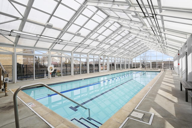community pool with a patio area and a lanai
