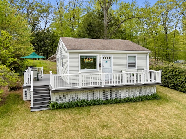 17 Glimmer Gln, East Haddam, CT 06415 - rear view of house with a deck, a lawn, a shingled roof, and view of scattered trees