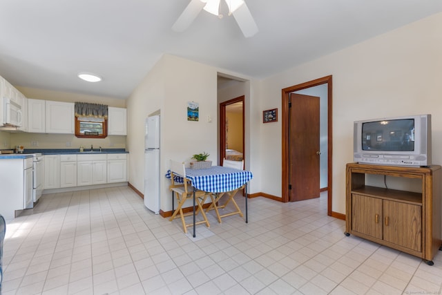 17 Glimmer Gln, East Haddam, CT 06415 - kitchen with white appliances, white cabinetry, ceiling fan, a sink, and baseboards