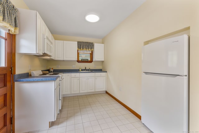 17 Glimmer Gln, East Haddam, CT 06415 - kitchen featuring white appliances, a sink, dark countertops, white cabinets, and baseboards