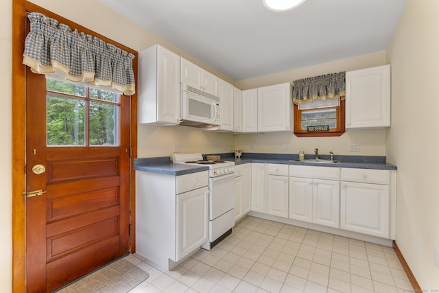 17 Glimmer Gln, East Haddam, CT 06415 - kitchen with white appliances, a sink, dark countertops, and white cabinetry