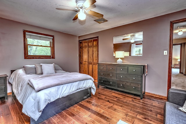 1540 Paradise Ave, Hamden, CT 06514 - bedroom featuring hardwood / wood-style flooring, a ceiling fan, a textured ceiling, and baseboards