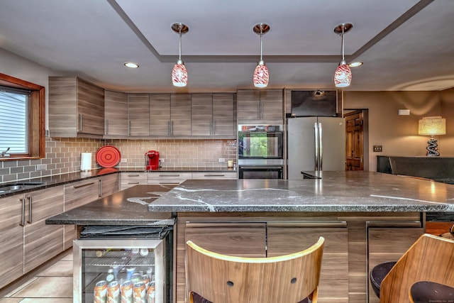 1540 Paradise Ave, Hamden, CT 06514 - kitchen featuring multiple ovens, freestanding refrigerator, wine cooler, backsplash, and modern cabinets