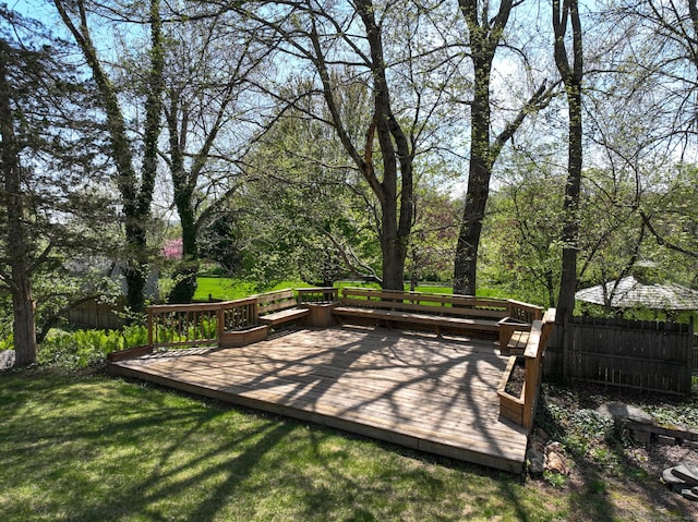 exterior space featuring fence and a wooden deck