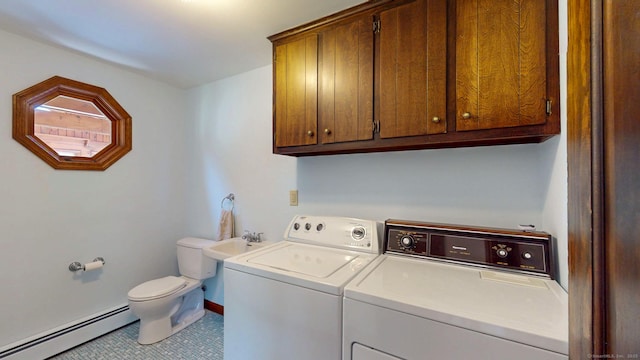 laundry area with laundry area, independent washer and dryer, tile patterned floors, baseboards, and a baseboard heating unit