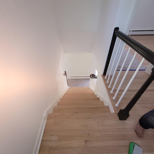 91 Jennifer Rd, Hamden, CT 06514 - stairway featuring wood finished floors and a baseboard heating unit