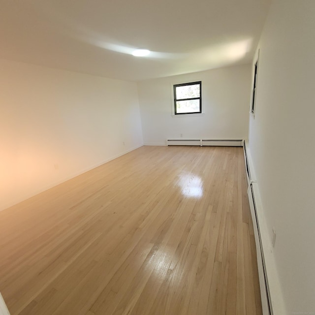 91 Jennifer Rd, Hamden, CT 06514 - unfurnished room with baseboard heating and light wood-style flooring