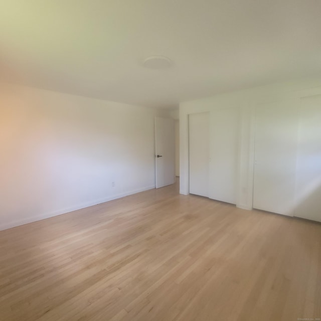 91 Jennifer Rd, Hamden, CT 06514 - unfurnished bedroom featuring light wood-style floors and baseboards