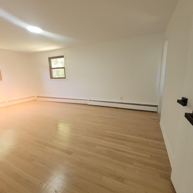 91 Jennifer Rd, Hamden, CT 06514 - spare room with light wood-type flooring, baseboard heating, and baseboards