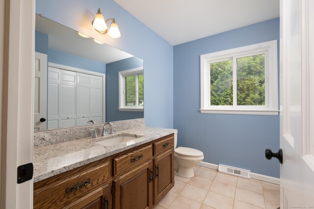39 Amato Cir, Southington, CT 06489 - bathroom with vanity, toilet, healthy amount of natural light, and tile patterned flooring