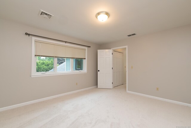39 Amato Cir, Southington, CT 06489 - spare room featuring baseboards and light carpet