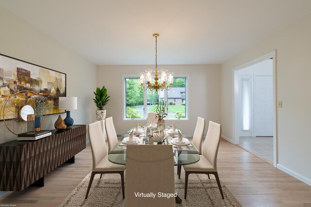 39 Amato Cir, Southington, CT 06489 - dining space featuring a chandelier, light wood-style floors, and baseboards