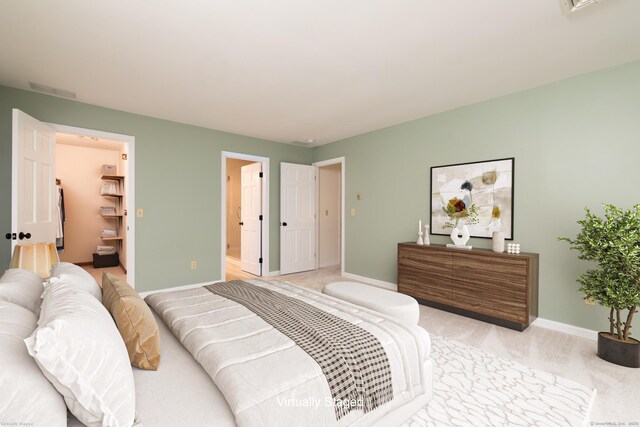 39 Amato Cir, Southington, CT 06489 - bedroom featuring baseboards, ensuite bath, light carpet, and a spacious closet
