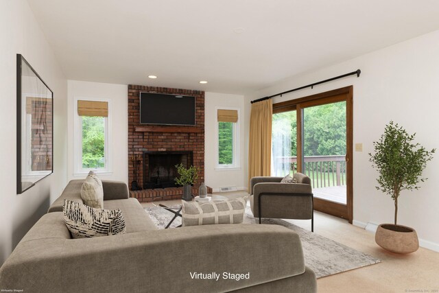 39 Amato Cir, Southington, CT 06489 - living area with carpet flooring, baseboards, a brick fireplace, and recessed lighting