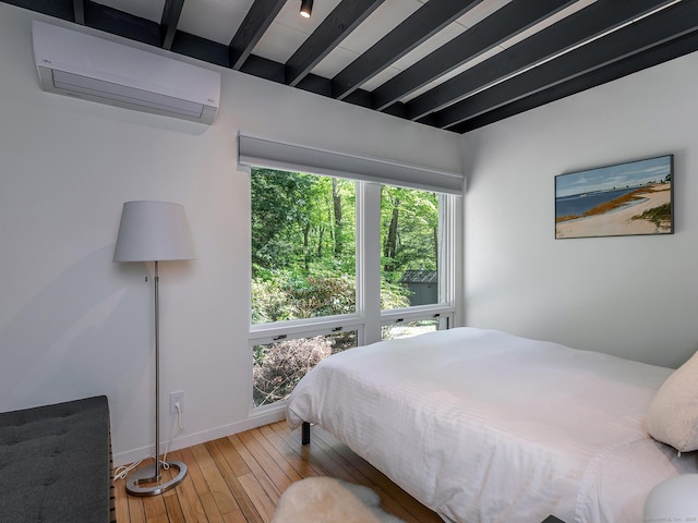 19 Spargo Rd, Roxbury, CT 06783 - bedroom featuring an AC wall unit, beamed ceiling, hardwood / wood-style floors, and baseboards