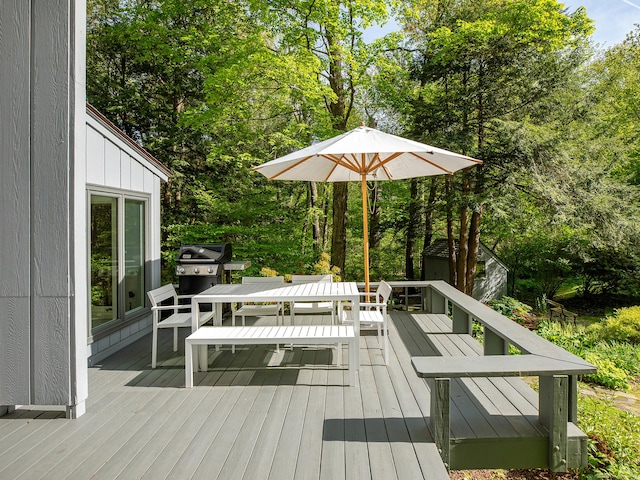 19 Spargo Rd, Roxbury, CT 06783 - deck with outdoor dining area, a shed, an outdoor structure, and view of wooded area