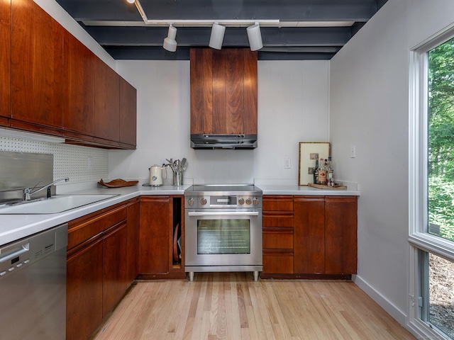 19 Spargo Rd, Roxbury, CT 06783 - kitchen with appliances with stainless steel finishes, a sink, ventilation hood, light wood finished floors, and light countertops