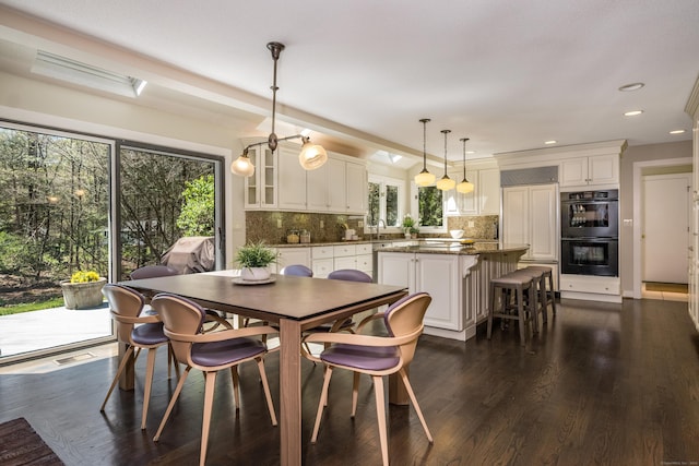 dining area featuring recessed lighting, dark wood finished floors, and visible vents