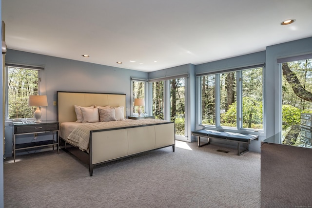 carpeted bedroom featuring recessed lighting
