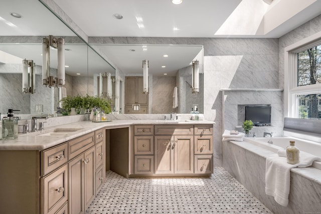 bathroom featuring double vanity, tile walls, and a sink