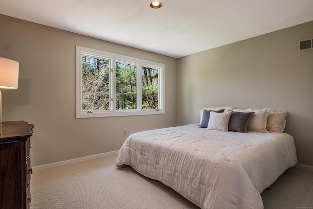 bedroom with light colored carpet, recessed lighting, baseboards, and visible vents