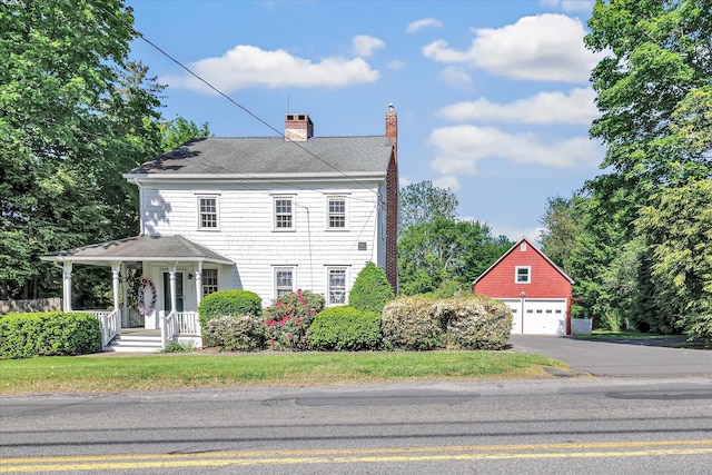 331 Elm St, Monroe, CT 06468 - view of front of house with a chimney, covered porch, a shingled roof, an outdoor structure, and a detached garage