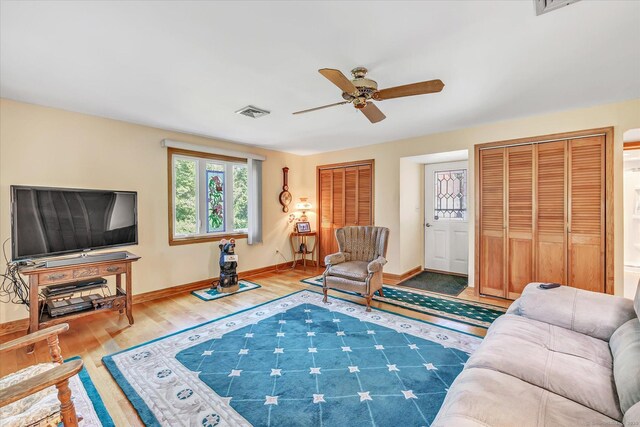 331 Elm St, Monroe, CT 06468 - living room featuring a ceiling fan, wood finished floors, and baseboards