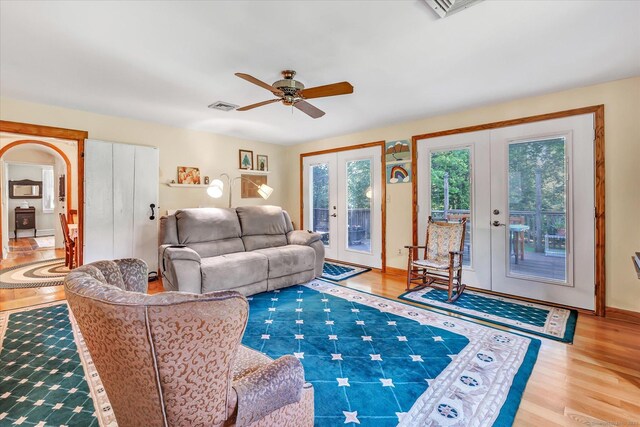 331 Elm St, Monroe, CT 06468 - living area featuring french doors, a ceiling fan, wood finished floors, and arched walkways