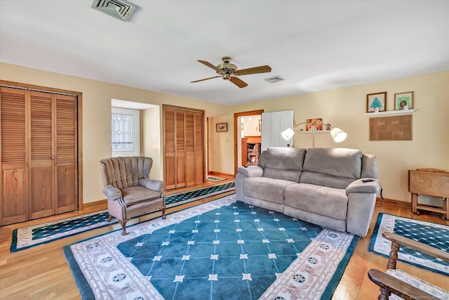 331 Elm St, Monroe, CT 06468 - living room featuring a ceiling fan, wood finished floors, and baseboards