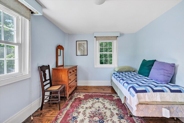 331 Elm St, Monroe, CT 06468 - bedroom featuring multiple windows, wood finished floors, and baseboards