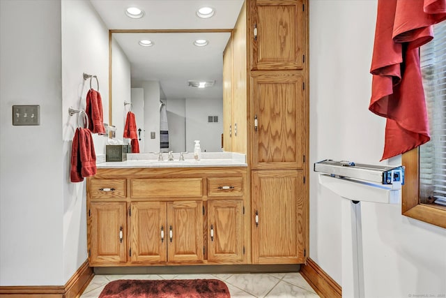331 Elm St, Monroe, CT 06468 - bathroom with recessed lighting, baseboards, vanity, and marble look tiles