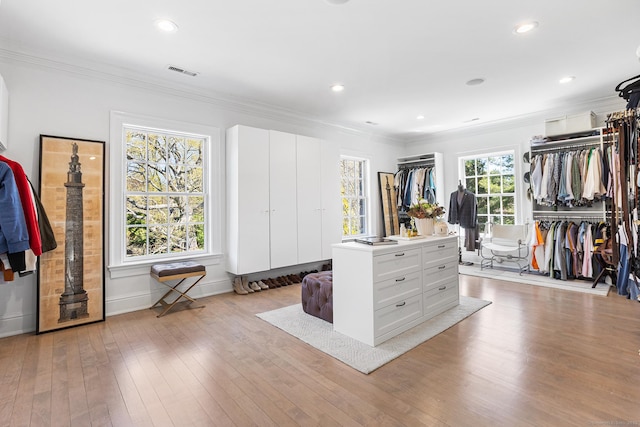 walk in closet with visible vents and light wood-type flooring