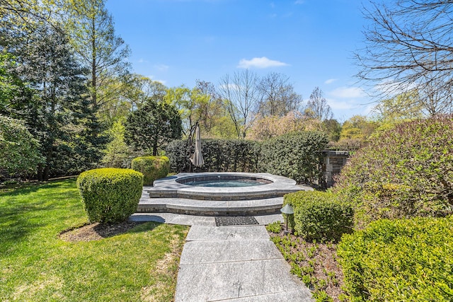 view of community featuring a lawn and a hot tub