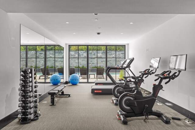 41 Richmondville Ave Unit 206, Westport, CT 06880 - exercise room featuring healthy amount of natural light, expansive windows, and recessed lighting