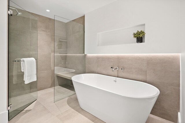 41 Richmondville Ave Unit 206, Westport, CT 06880 - full bathroom with tile walls, a tile shower, a freestanding bath, and tile patterned floors